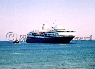 Olympic Voyager alongside
